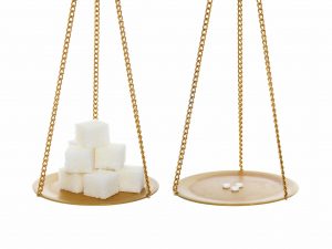 Sugar vs small healthy sugar sweeteners. On balance. Isolated over white