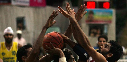 MUMBAI, INDIA - OCTOBER 16, 2006: Basketball - Punjab skipper Jagdeep (15) is fenced by Indian Army's Jai Ram Jat (13) and Jaswant Singh (8) during their match in the Ramu Memorial Basketball Tournament at Indian Gymkhana. (Photo by Ritesh Uttamchandani/Hindustan Times via Getty Images)