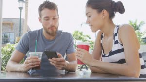 image source: http://www.shutterstock.com/video/clip-8992519-stock-footage-cafe-couple-looking-at-smart-phone-screen-app-laughing-having-fun-on-date-drinking-coffee-in-summer.html