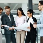 Corporate teamworking colleagues in modern office