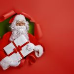Santa Claus on color background.