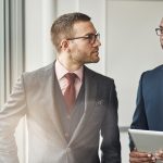 Two stylish corporate executives in a discussion