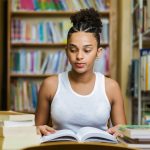 Black african american young girl student studying at the school