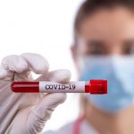 Doctor with a sample blood test tube