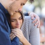 woman-crying-man-comforting
