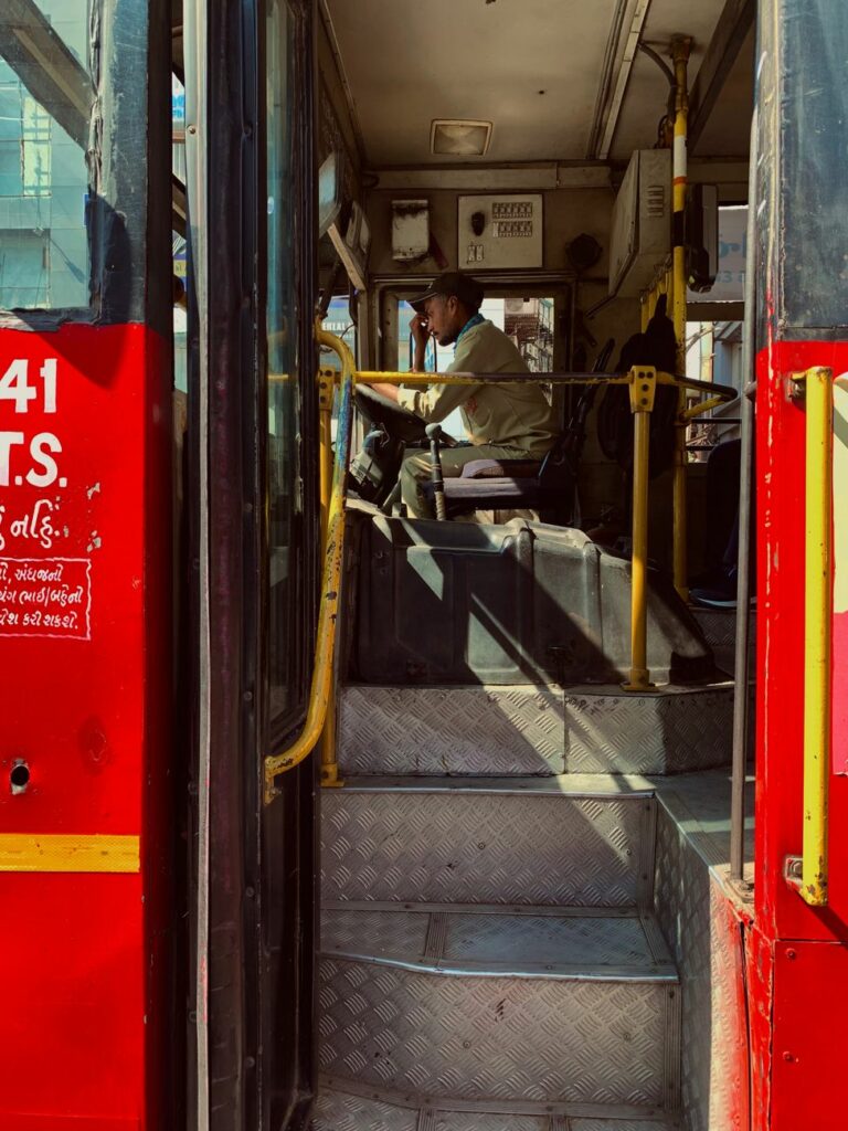 man sitting inside a bus