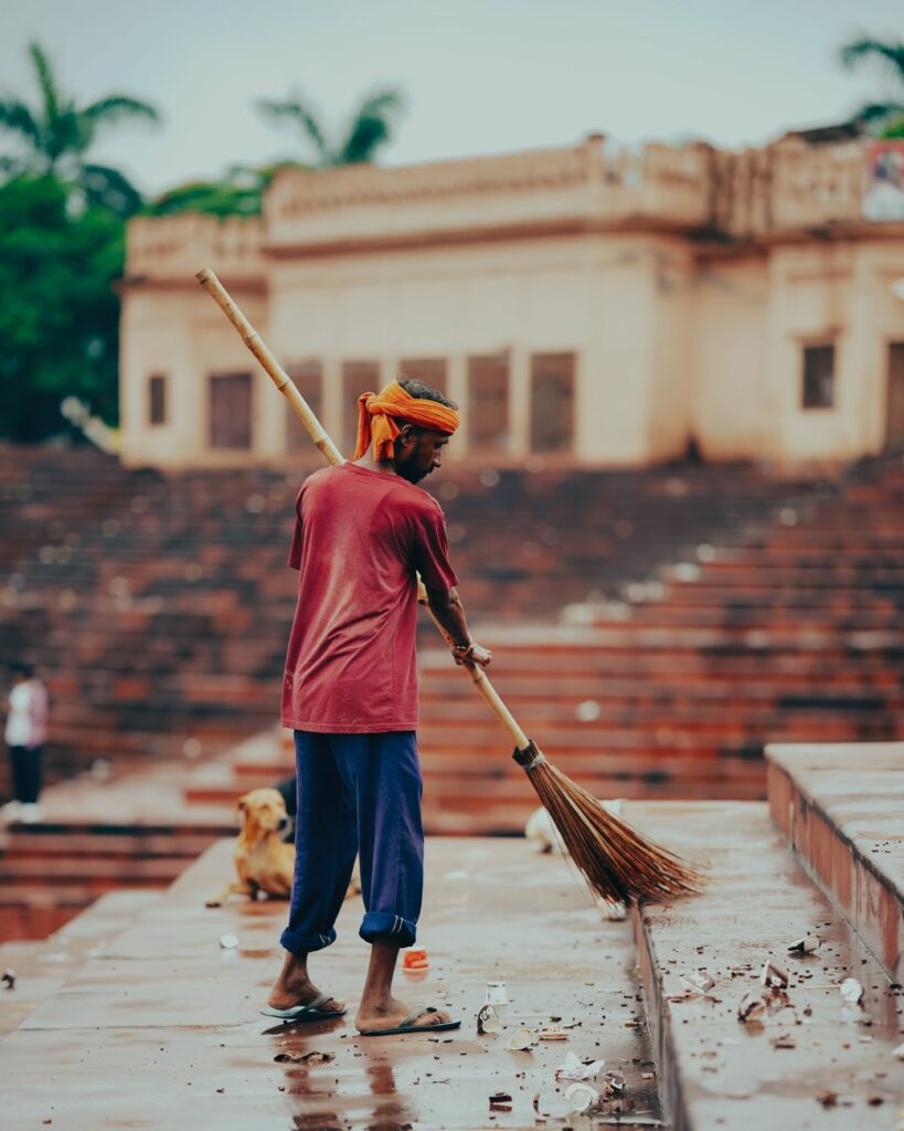 man cleaning street
