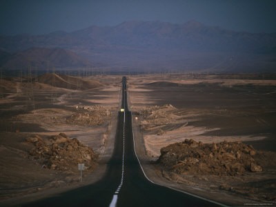 power towers line the pan american highway in the atacama desert
