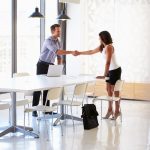 Businessman shaking hands with a job applicant