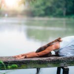 Yoga Woman by The Lake. Balasana