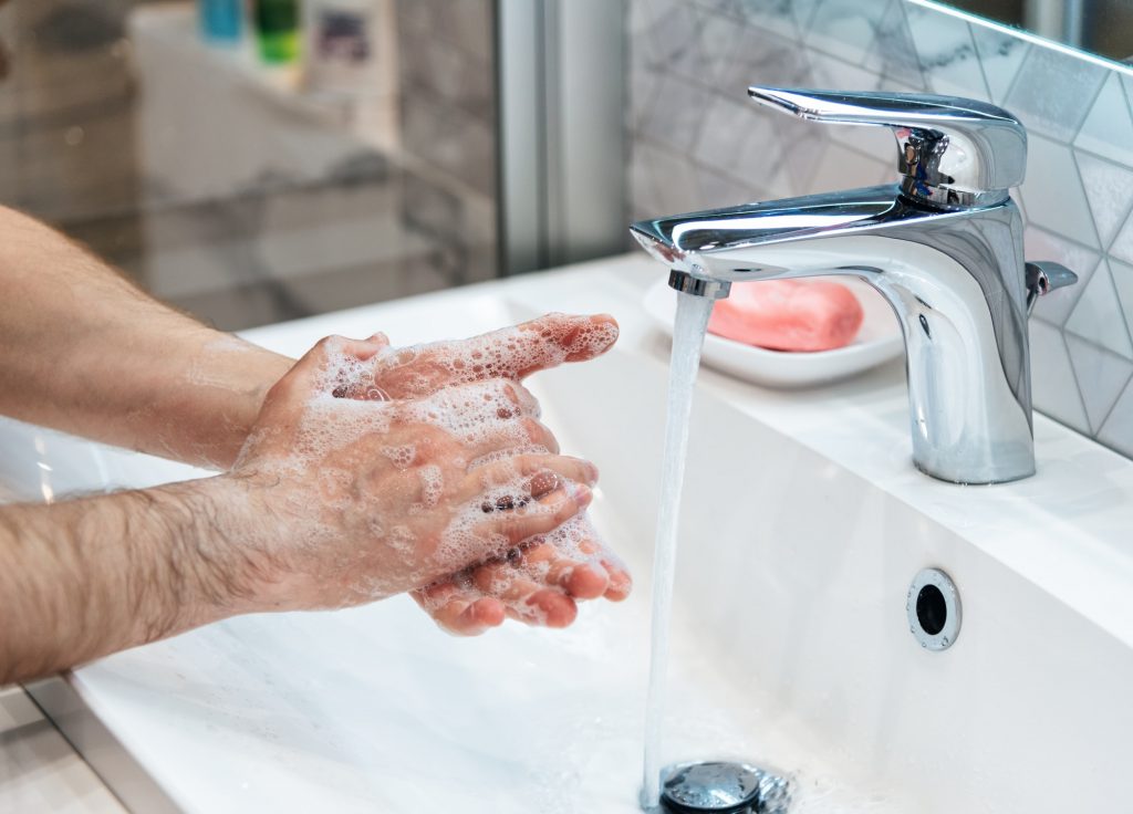 Man is washing hands with soap. Coronavirus pandemic. Covid-19