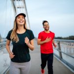 Healthy sporty young people jogging and running outdoors