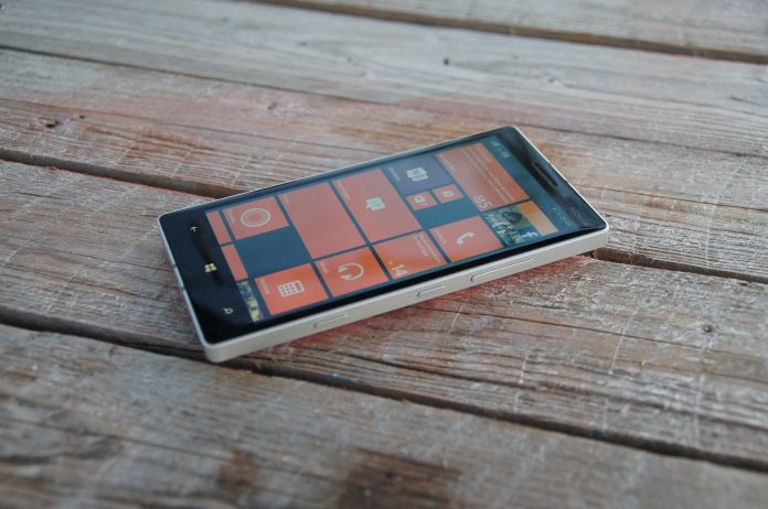 A Lumia device resting on a hardwood Table