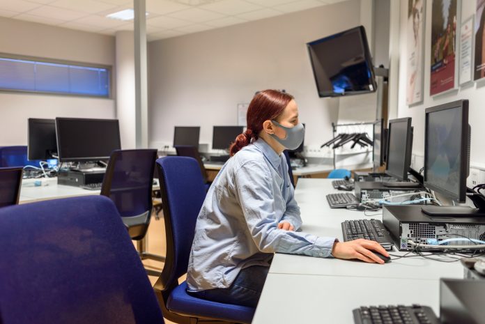 Woman student in computer class