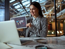 Joyful young trader following online business courses
