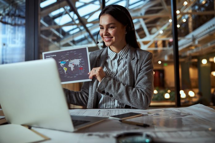 Joyful young trader following online business courses