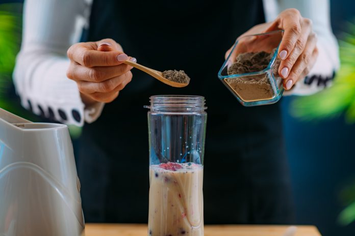 Making Healthy Shake with Berries and Plant Protein Powder