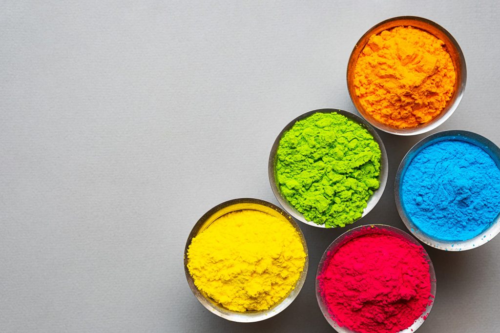 Traditional, Indian Colorful Holi Powder Paint in Steel Bowls.