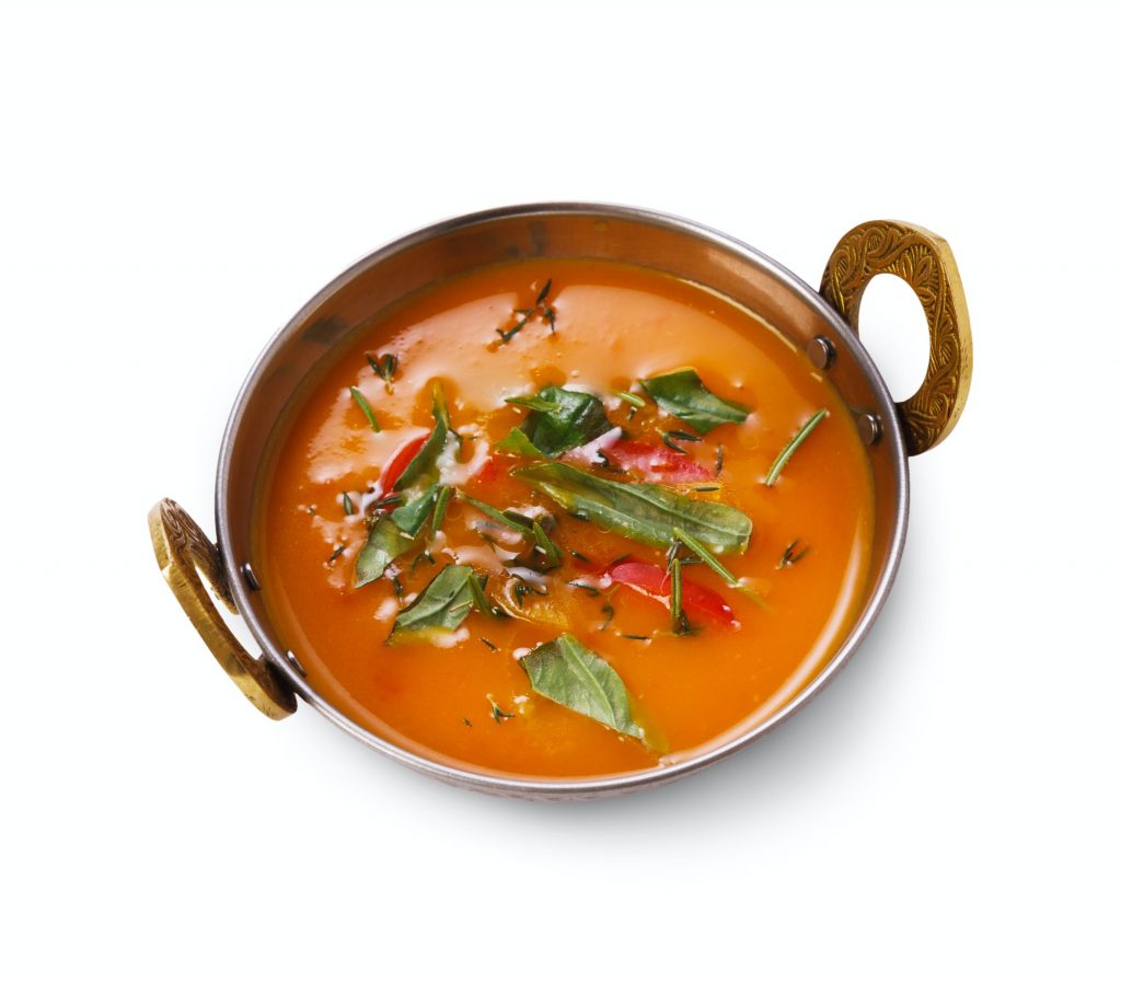 Vegan and vegetarian indian cuisine dish, spicy tomato creamy soup