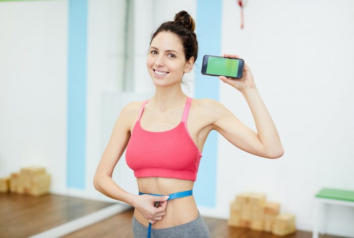 Smiling Woman Presenting Weightloss App