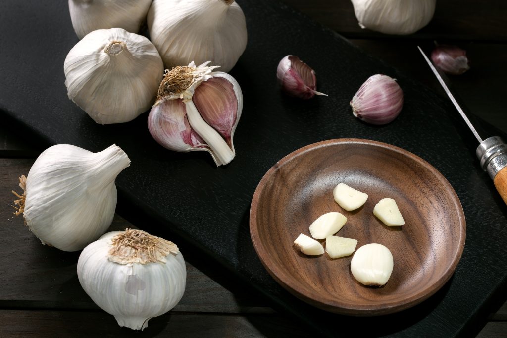 Garlic and garlic cloves on cutting board