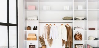 Interior Of Huge Wardrobe With Female Clothes On Shelves Indoors