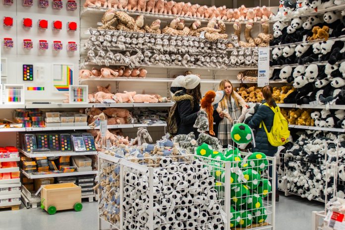 In the IKEA store: a group of teenage girls in the toy Department