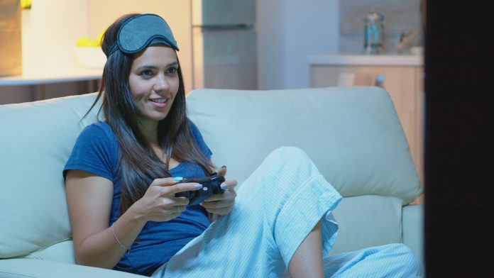 Gamer using joystick playing video games