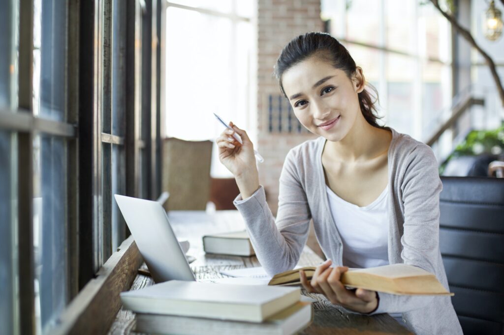 Young woman studying in cafe