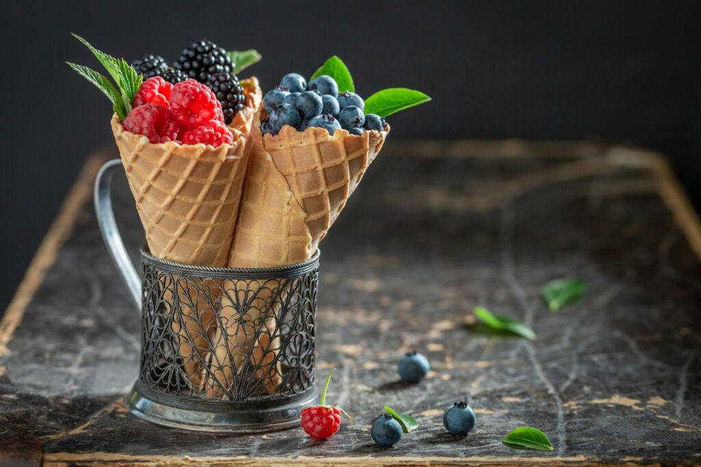 Delicious berries in waffels as concept of ice cream