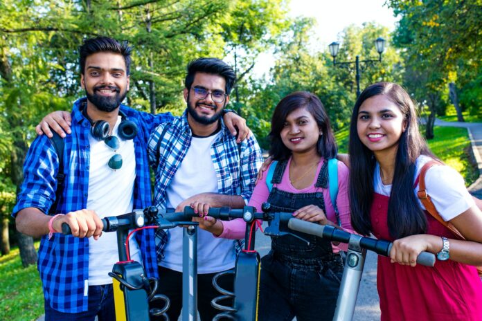 modern indian friends ride on segway in park in India