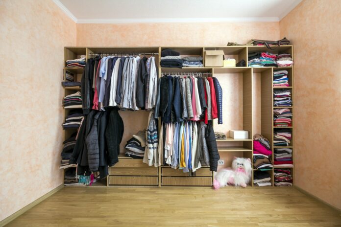 Wardrobe full of different men and woman clothes