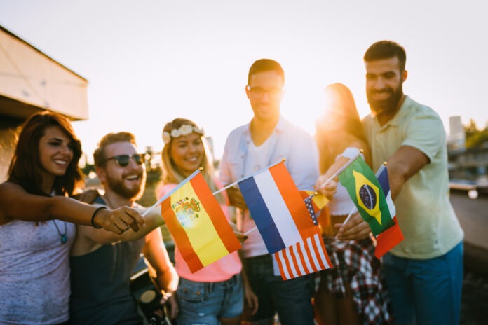 Group of people holding national flags