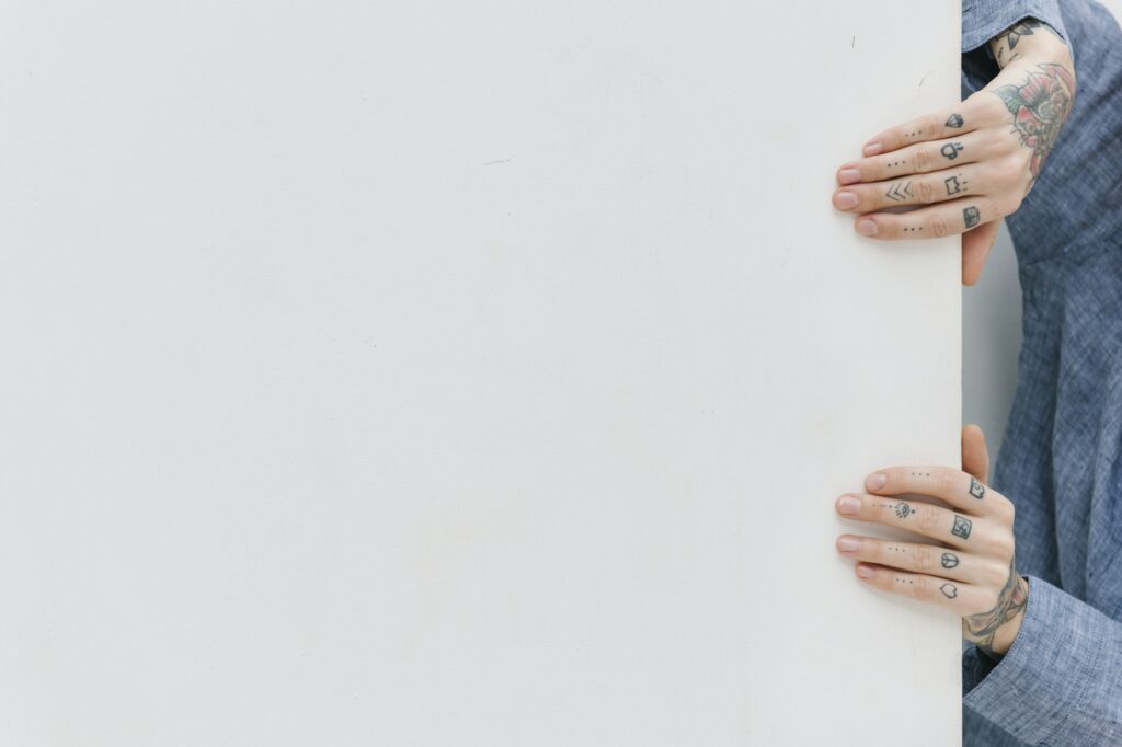 Girl with tattooed hands