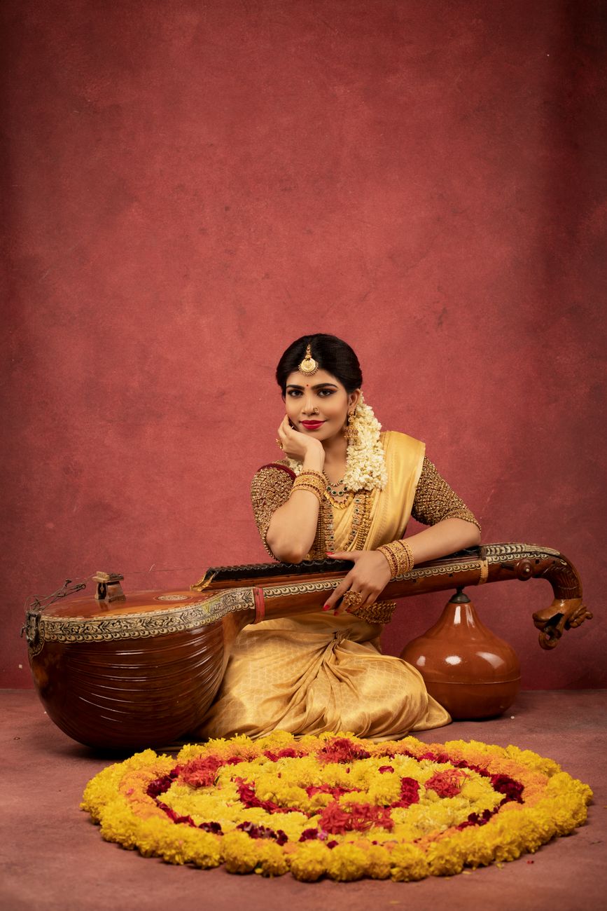 a woman posing with a musical instrument