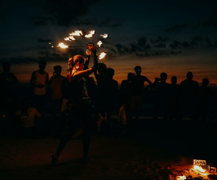 people standing on beach during night time