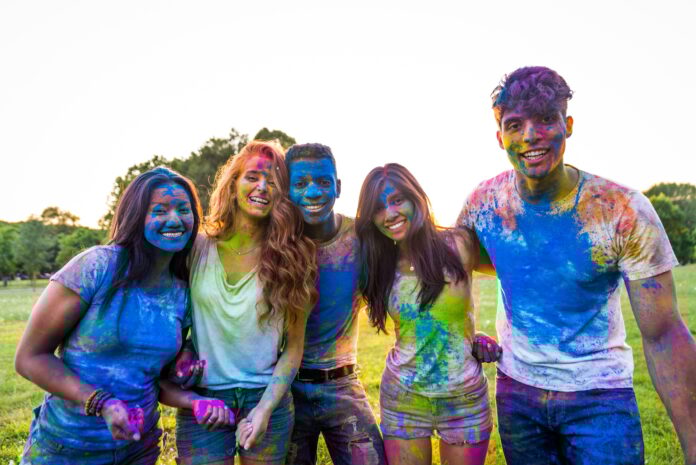 Friends playing with holi powder